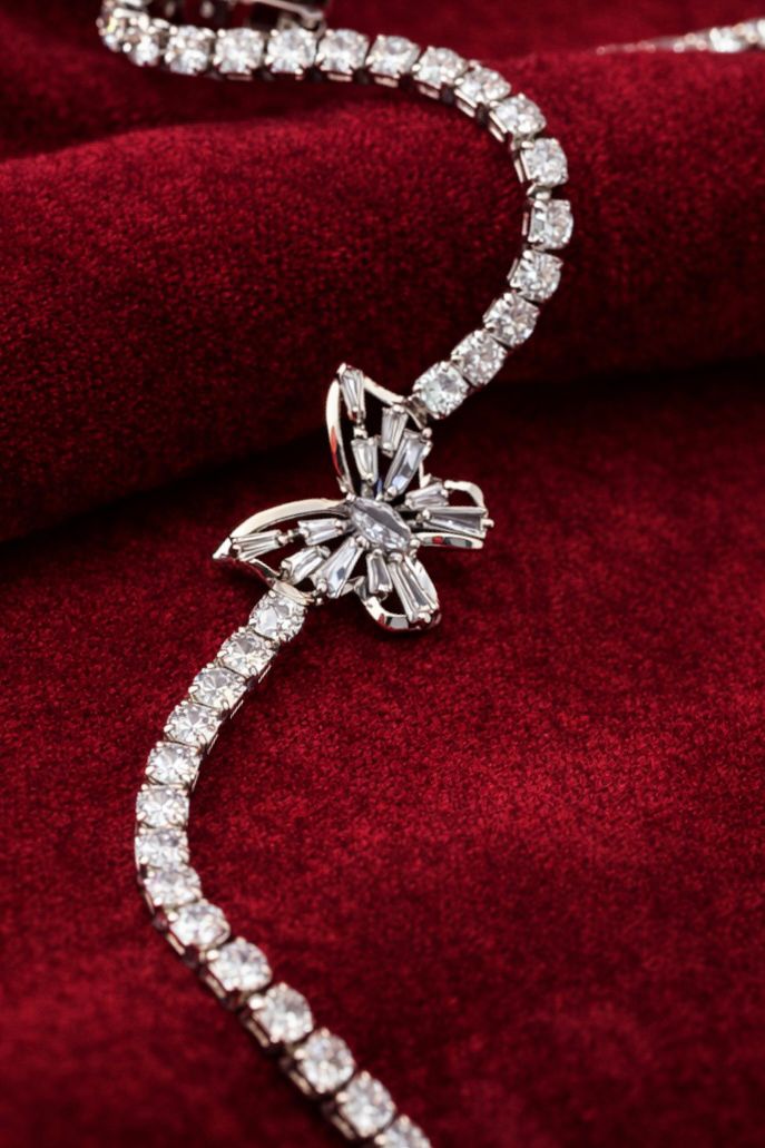 Silver crystal tennis bracelet with butterfly charm